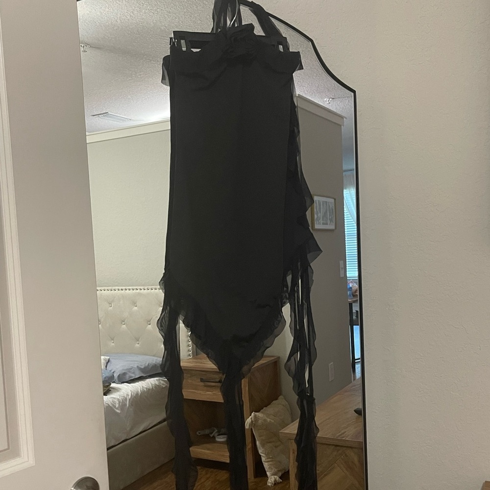 Mini black dress with rise detail